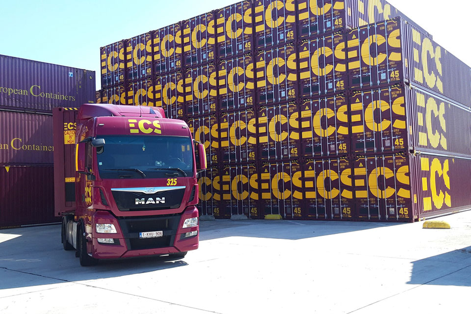 Truck stationary near containers